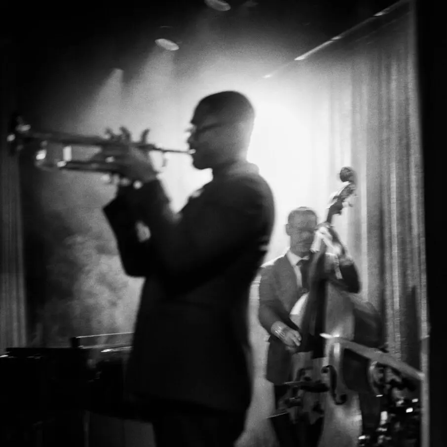 A horn player and a bassist on stage at The Jazz Club at Aman New York